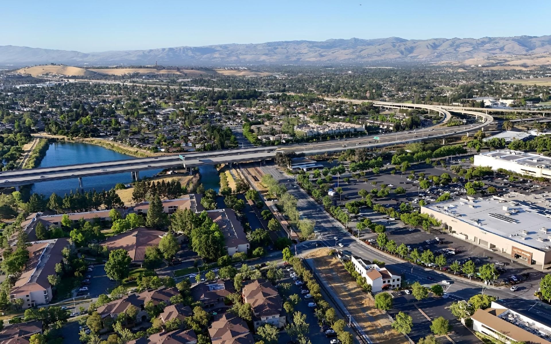 Aerial view of a South Bay city with distant hills