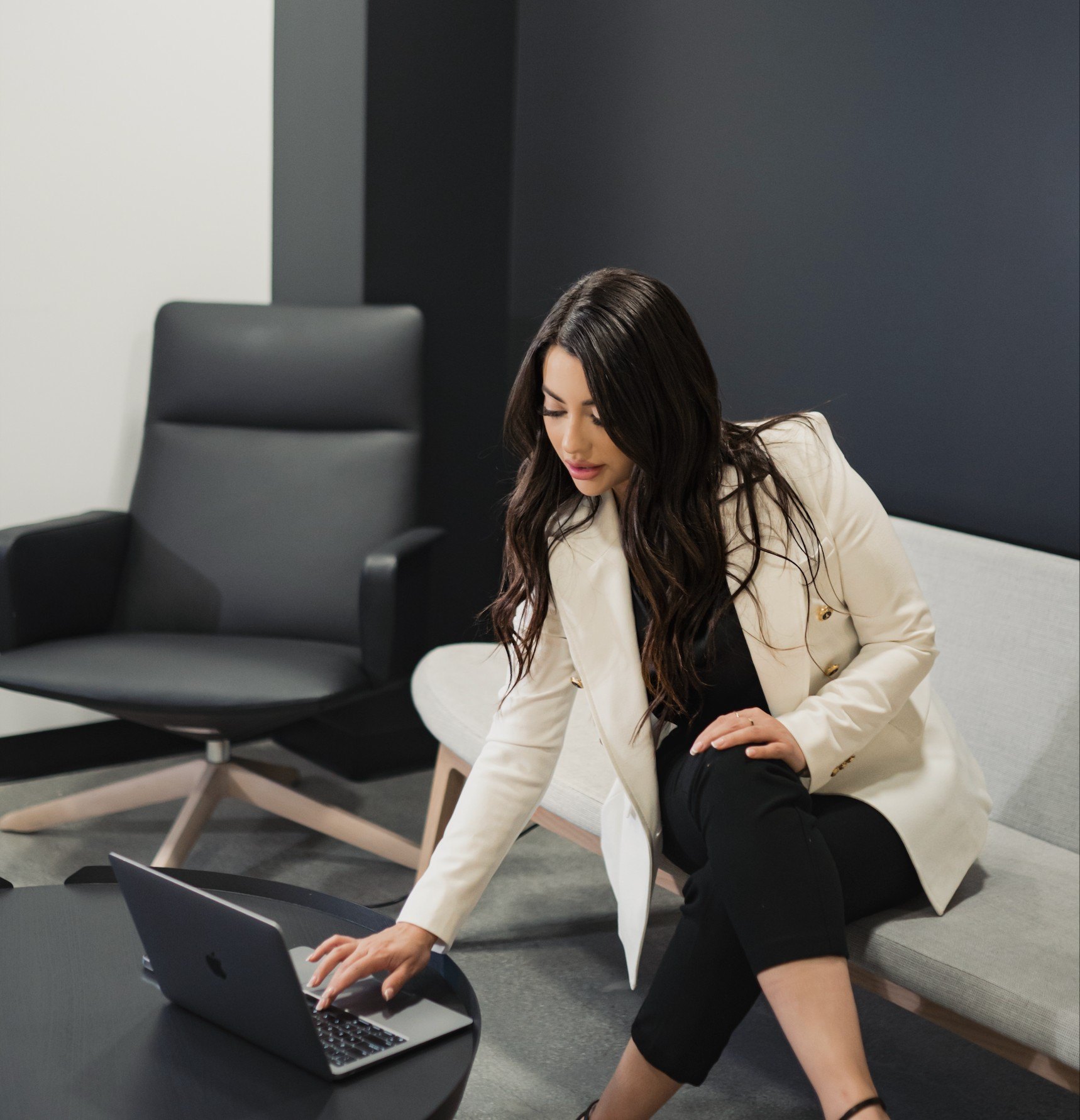 Sandra Ruelas working at a laptop